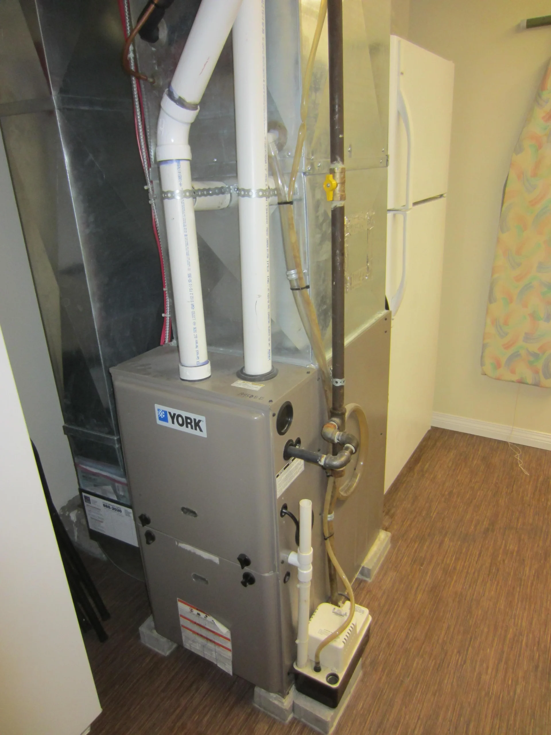 Condensing forced-air gas furnace with connected air ducts